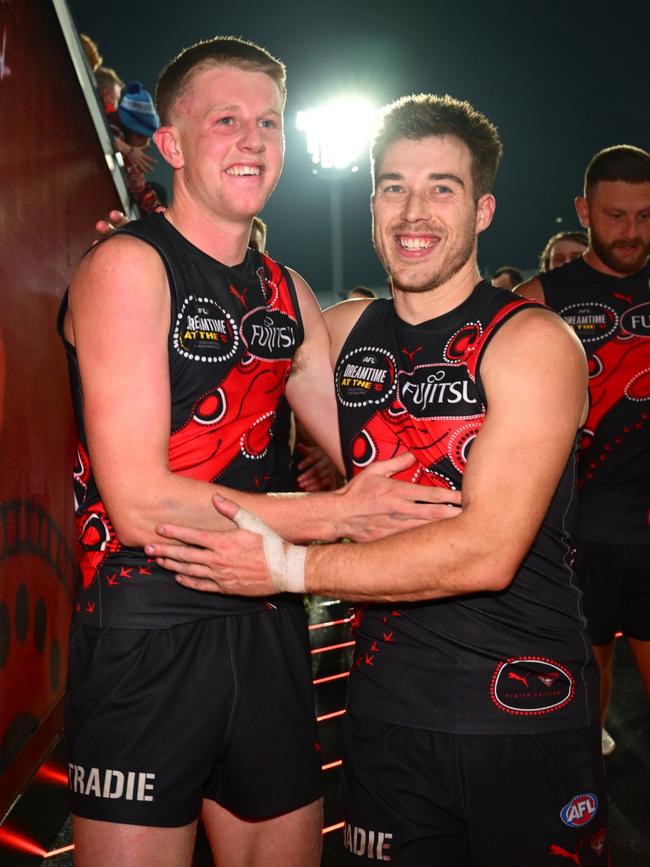 Angus Clarke with Zach Merrett after the Bombers’ win. Picture: by Quinn Rooney/Getty Images