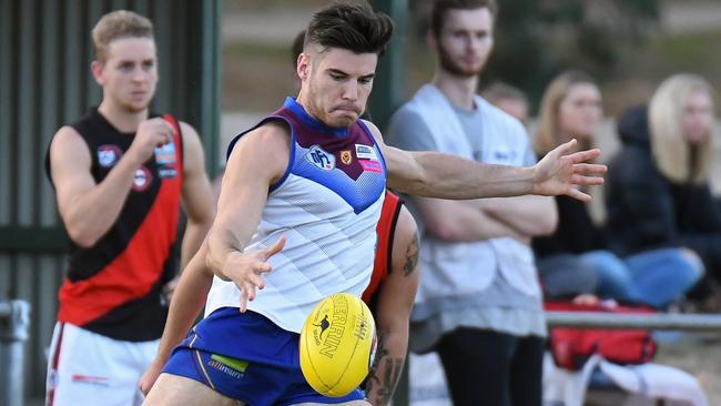 James Kroussoratis gets a kick away for Banyule. Picture: Nathan William Media