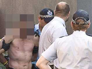 A 41-year-old Toowoomba man is taken into custody after a siege at the Department of Communities’ Child Safety Service Centre. Picture: Nev Madsen