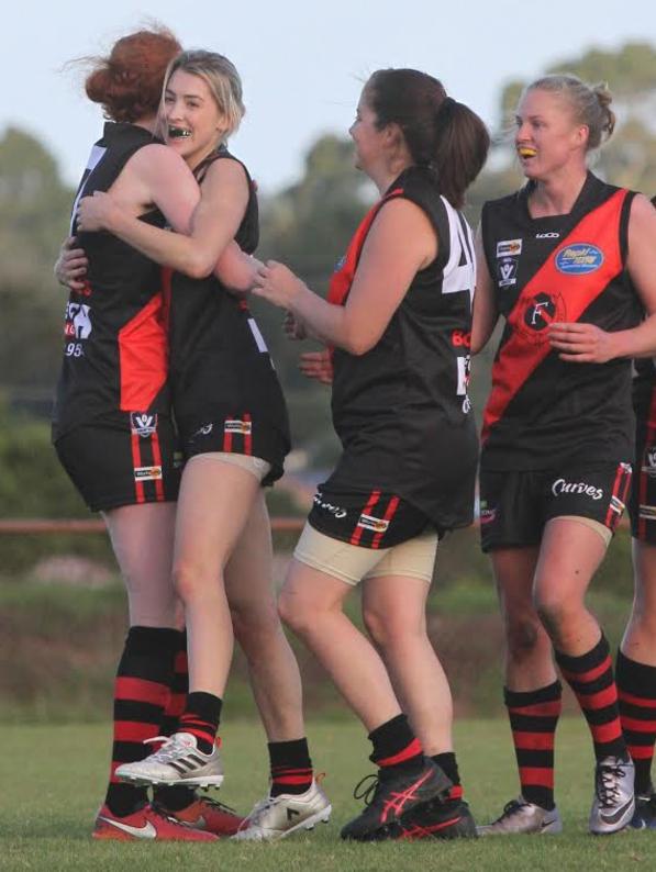 Alex Nation (second from left) celebrates a goal. Picture: Cheryl Cameron.