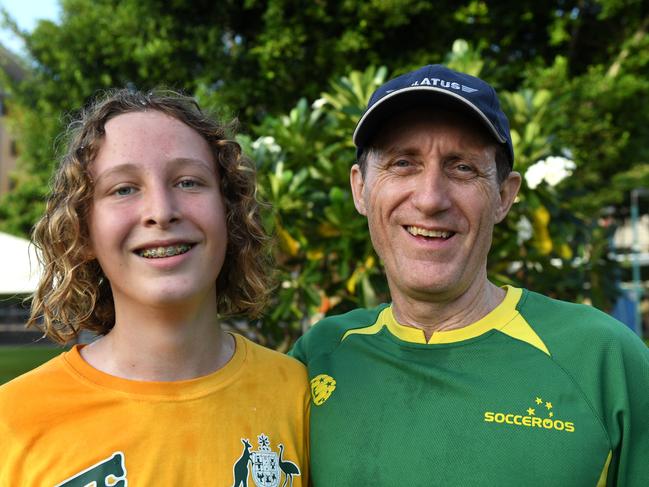 Adam van Wessel, 14, and dad Rob van Wessel at the finish line of the Oz Run at the Darwin Waterfront. Picture: Che Chorley