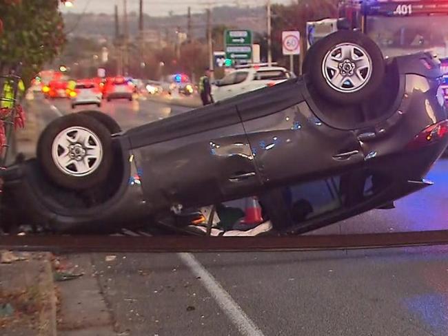 Marion Road at South Plympton has been closed off to traffic after a car slammed into a stobie pole and flipped. Picture: 7News.