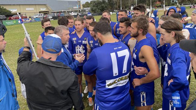 Hastings coach Gavin Artico addresses his players at three-quarter time.