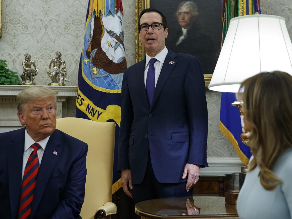 President Donald Trump and first lady Melania Trump listen as Treasury Secretary Steve Mnuchin announces sanctions on Iran. Picture: AP