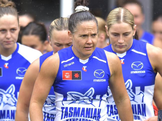 LAUNCESTON, AUSTRALIA - SEPTEMBER 29: Emma Kearney of the Kangaroos leads her team on to the field during the round five AFLW match between North Melbourne Kangaroos and Richmond Tigers at University of Tasmania Stadium, on September 29, 2024, in Launceston, Australia. (Photo by Simon Sturzaker/Getty Images)