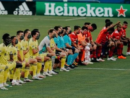 MLS players kneel before match