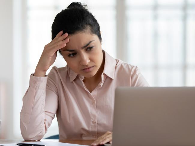 Unhappy young woman frustrated with virus or scam, investment, bills generic sad