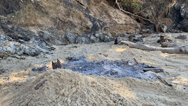 Remnants of a fire were evident the day after a wild beach party at Sawtell. Picture: Janine Watson