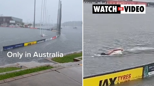 Aussie captured swimming through wild flood waters