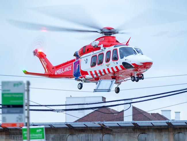 An Air Ambulance helicopter, lands on the helipad at The Alfred hospital, Commercial Road, Prahran. Ambulance Victoria, HEMS, Helicopter Emergency Medical Service. Picture: Mark Stewart