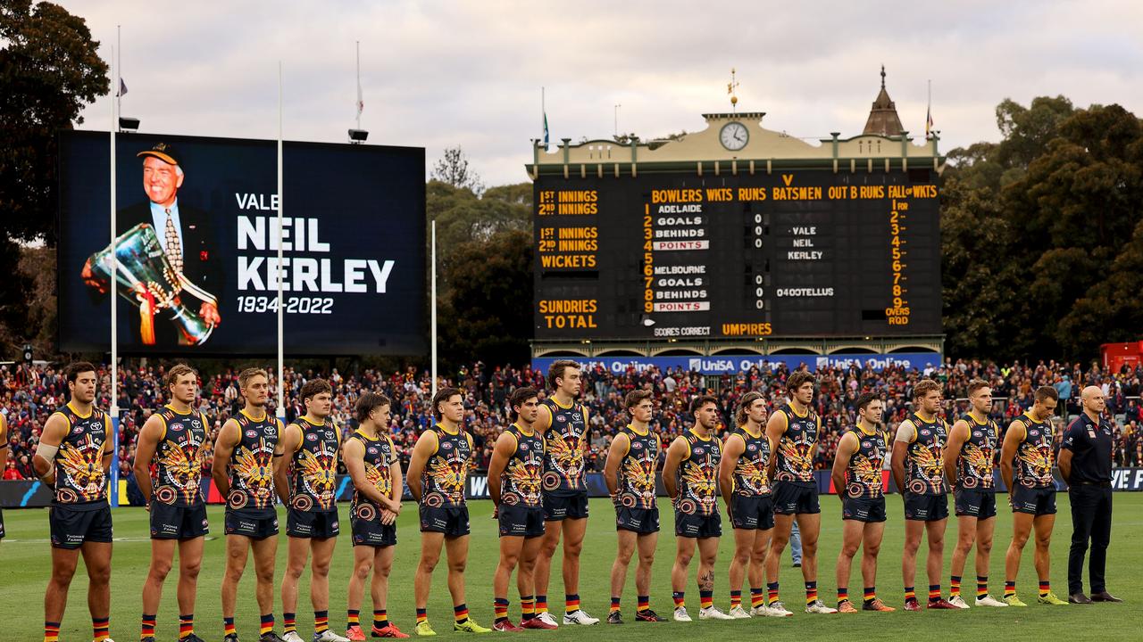 The Crows and Adelaide Oval fans stand in silence to honour SA footy legend Neil ‘Knuckles’ Kerley. Picture: AFL Photos/Getty Images