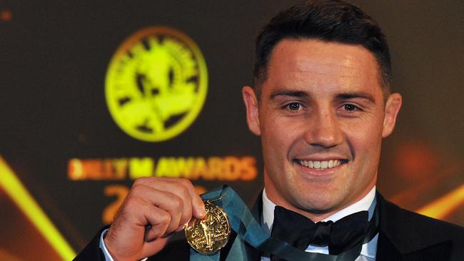 **FILE** A Tuesday, Oct. 1, 2013 image reissued Tuesday, April 4, 2017 of Melbourne Storm halfback Cooper Cronk poses with the Dally M medal at the 2013 NRL Dally M Awards at The Star in Sydney. Cooper Cronk will seek to join a Sydney club after reportedly deciding to leave Melbourne at the end of the NRL season. (AAP Image/Paul Miller) NO ARCHIVING