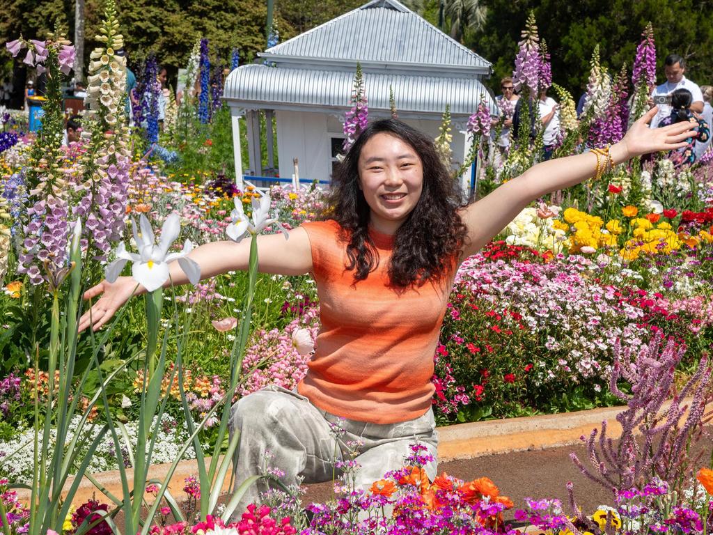 Leslie Niu enjoys the Botanic Garden display in Queens Park during the Carnival of Flowers, Sunday, September 22, 2024. Picture: Bev Lacey