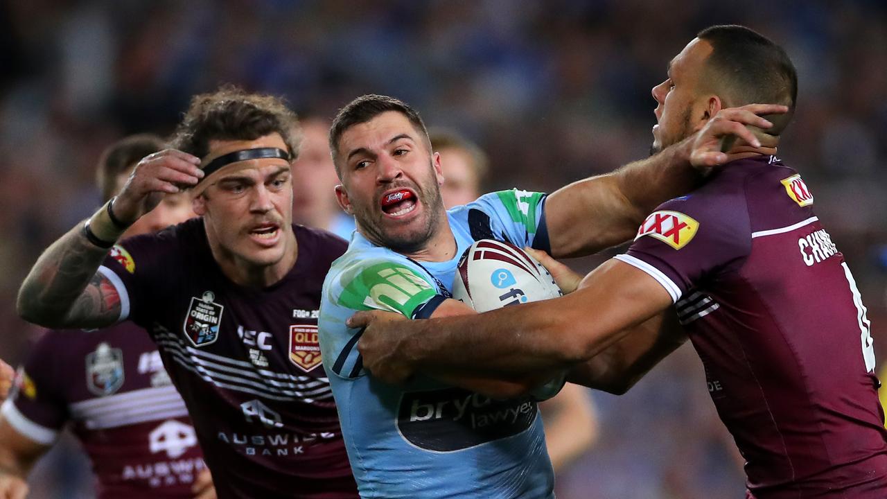 New South Wales fullback James Tedesco attempts to break through the Queensland line. (Photo by Cameron Spencer/Getty Images)