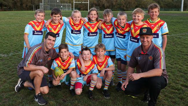 Michael Ennis and son Randy for De La Salle in the Under 9s Grand Final. Photo: Brett Costello