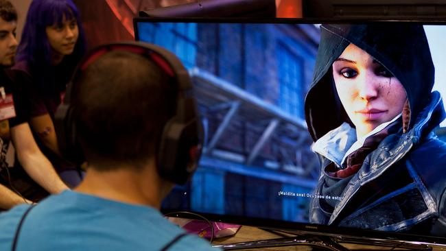 (FILES) In this file photo taken on October 01, 2015 Videogamers play on an alpha version of French video game developer Ubisoft's last installment of "Assassin's Creed", titled "Assassin's Creed Syndicate", during the Madrid Games Week 2015 in Madrid. - Google is looking to transform internet-age game play, with an expected launch of a streaming service which uses the tech giant's power in the internet cloud. Expected Tuesday, March 19, 2019. is the debut of a ramped-up version of a cloud gaming platform Google tested recently in partnership with Ubisoft. A video clip teasing a keynote presentation at an annual Game Developers Conference in San Francisco invites people to "Gather around as we unveil Google's vision for the future of gaming." (Photo by SEBASTIEN BERDA / AFP)