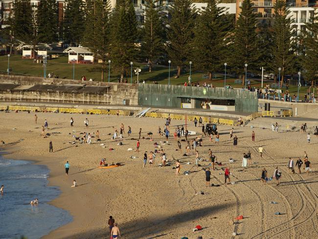 Large crowds of people on Coogee beach on Anzac day. Very difficult to keep the social distancing rules with this many people.Photo: Tim Pascoe