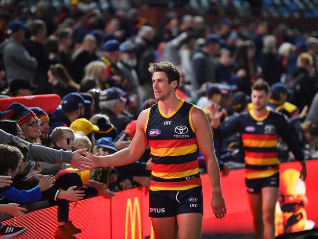 Kyle Hartigan of the Crows celebrates with the crowd after Adelaide’s Round Seven win over Fremantle at Adelaide Oval on May 5. Picture: AAP Image/David Mariuz