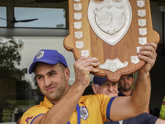 East Sandringham captain Guy Martyn lifts the Longmuir Shield. Picture: Valeriu Campan