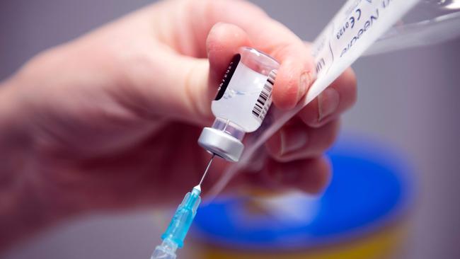 A nurse prepares the Pfizer/BioNtech COVID-19 vaccine prior to administration in Glasgow. Picture: AFP.