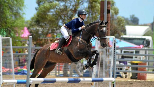 EQUINE LEAP: Darcey Tait is competing in the Queensland Interschool State Showjumping Championship. Picture: Contributed