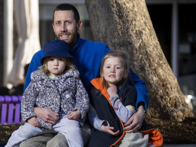 Duncan Jardine, 35, with daughters Eva, 2 and Celia, 5 in Canberra. Picture: Sean Davey.