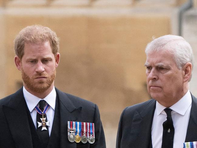 Britain's Prince Harry, Duke of Sussex (L) talks with Britain's Prince Andrew, Duke of York as they arrive at St George's Chapel inside Windsor Castle on September 19, 2022, ahead of the Committal Service for Britain's Queen Elizabeth II. - Monday's committal service is expected to be attended by at least 800 people, most of whom will not have been at the earlier State Funeral at Westminster Abbey. (Photo by David Rose / POOL / AFP)