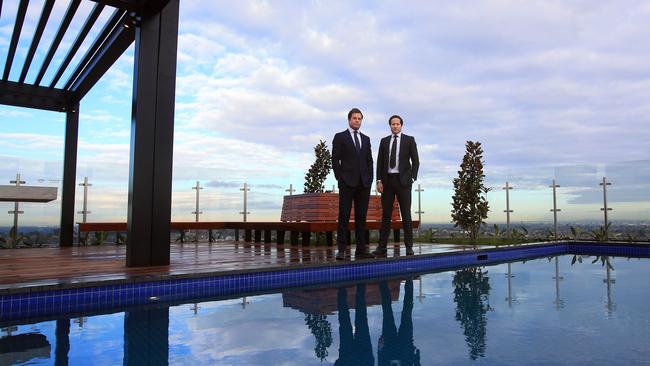 Developers Jonathan and Will Deague on the pool deck of Whitehorse Towers, the newest apartment complex in Box Hill when it was completed in 2017. Aaron Francis/The Australian