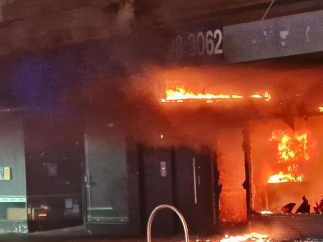 A Bridge Rd tobacco store fully alight on Saturday night. Picture: Supplied