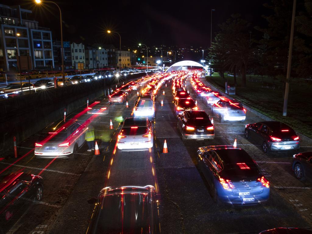 Evening queues at Bondi Beach drive-through Covid-19 testing clinic as a cluster of Covid-19 cases in Sydney's eastern suburbs continues to grow. Picture: Christian Gilles