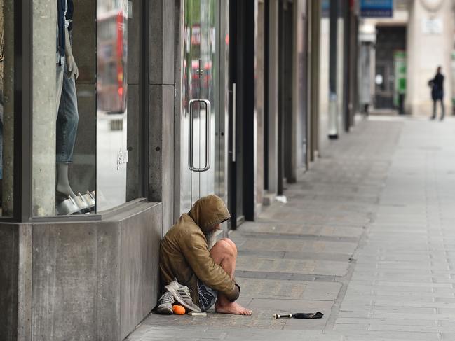 A homeless person is seen on Oxford Street in central London on May 3, 2020, during the nationwide lockdown due to the novel coronavirus COVID-19 pandemic. - The government Saturday, announced 621 more deaths in the outbreak, taking the overall cumulative toll to 28,131 -- just behind Europe's worst-hit country, Italy. (Photo by Glyn KIRK / AFP)