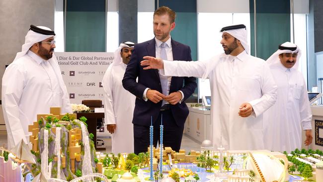 Eric Trump, executive vice-president of the Trump Organisation and the US president's son, looks over the proposed plan ahead of the signing ceremony with Qatar's Diar and Dar Global in Doha on April 30. Picture: AFP