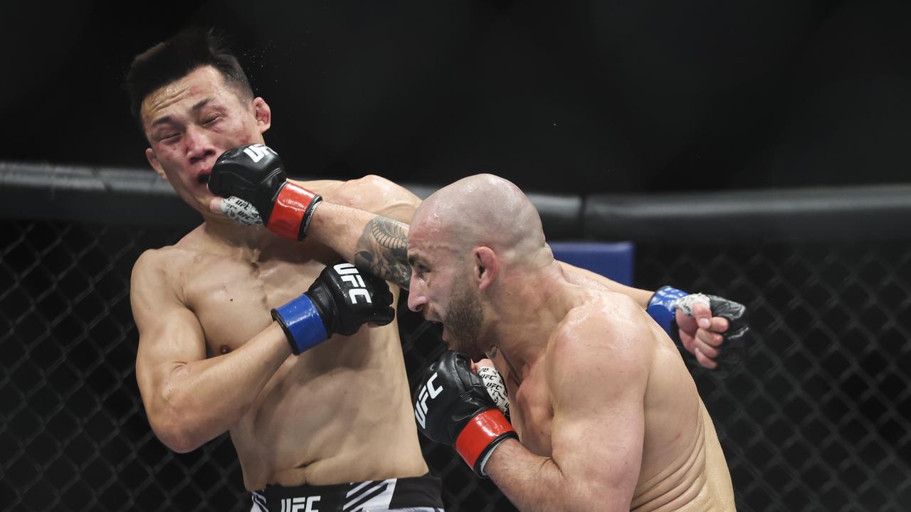 Alex Volkanovski lands heavily on Chan Sung Jung at UFC 273. James Gilbert/Getty Images/AFP