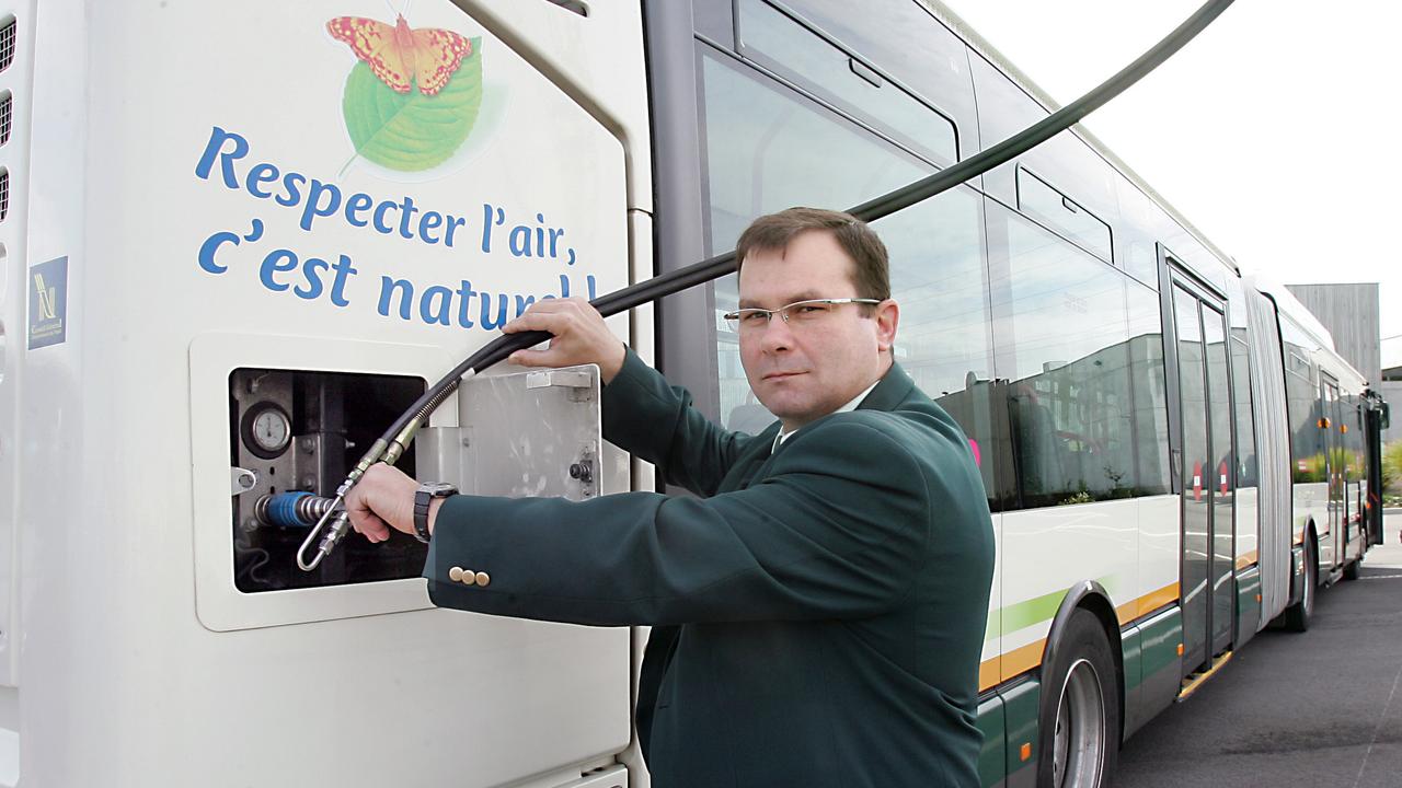 A European driver fills up his tank with biogas fuel made from organic household waste. Picture: AFP