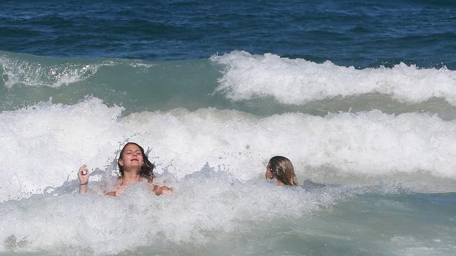 German tourists Ida Jaensch, 19, and Charlotte Gerhards, 20, know about the flags but chose to swim outside them. Picture: Glenn Hampson