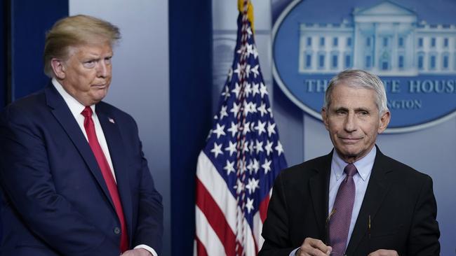 Only in the past few months has Anthony Fauci, right, acknowledged the possibility Covid-19 may have originated at the Wuhan institute. Here he appears with then US President Donald Trump in April last year.