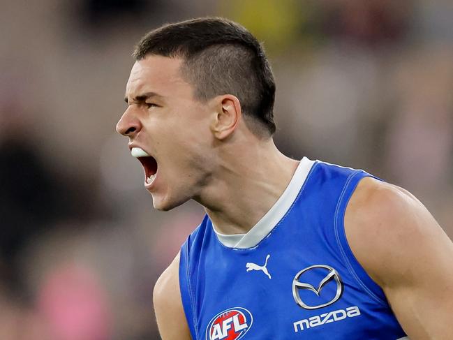 MELBOURNE, AUSTRALIA - JUNE 22: Luke Davies-Uniacke of the Kangaroos celebrates a goal during the 2024 AFL Round 15 match between the Melbourne Demons and the North Melbourne Kangaroos at The Melbourne Cricket Ground on June 22, 2024 in Melbourne, Australia. (Photo by Dylan Burns/AFL Photos via Getty Images)