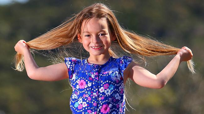 Ashleigh Elliot from Frenches Forest is growing her hair so she can cut it off to donate to kids with cancer