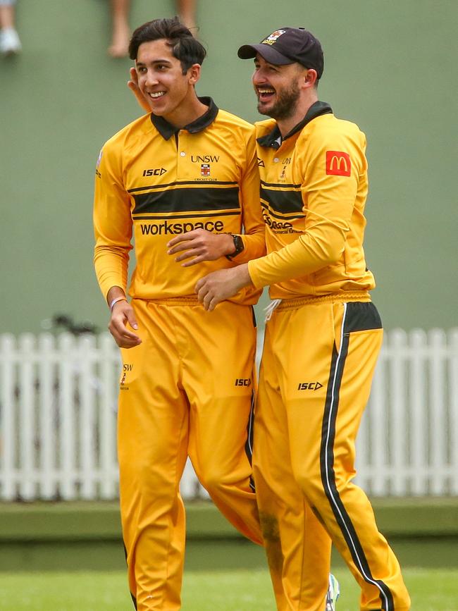 UNSW’s Ethan Jamieson celebrates with teammates. Picture Kate Zarifeh