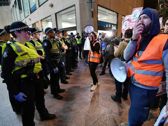 Police form a line in front of Campaign Against Racism protesters outside right-wing UK politician Nigel Farage’s speaking event.   Picture: Jake Nowakowski