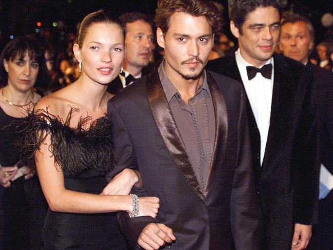 British supermodel Kate Moss with US Actors Johnny Depp and Benito Del Toro. Picture: AFP / Patrick Hertzog.