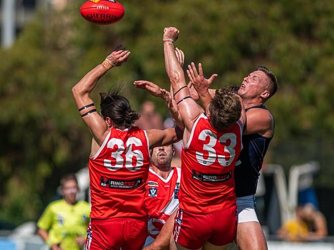 Sorrento's James Brigden (left) and Nick Marston (33) fly for a mark against Rosebud. Pictrure: David Caspar