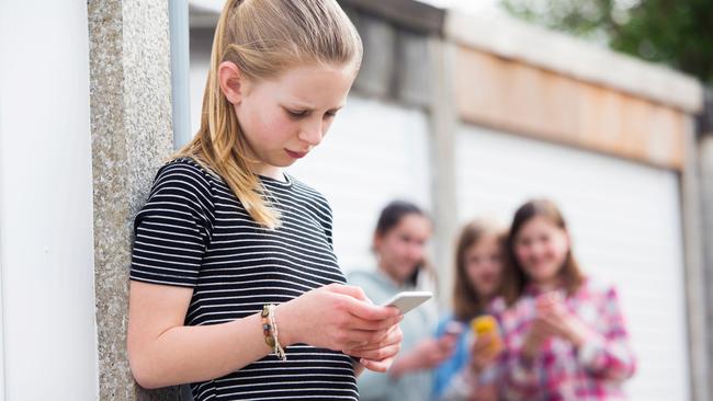 Victoria’s ban on mobiles at school aims to stop cyber-bullying ‘at the gate’.