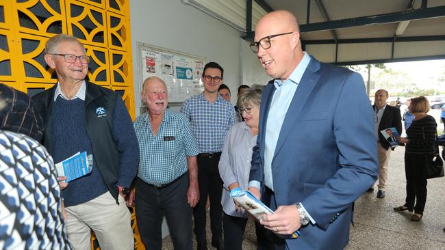 Federal Opposition Leader with candidates and party members coming in before the vote at a Fadden LNP preselection at Runaway Bay Community Centre in June. The Liberal Party and the LNP are run by their members, and MPs who stray too far from their opinions don’t last very long. Picture: Mike Batterham