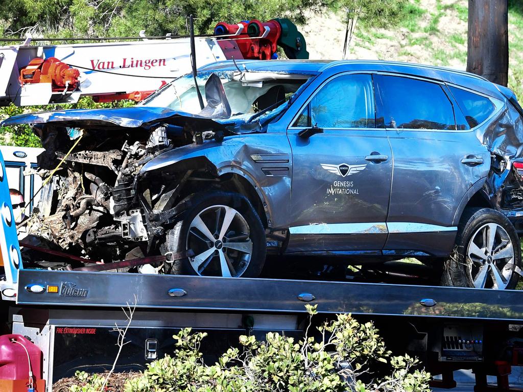 A tow truck recovers the vehicle driven by golfer Tiger Woods in Rancho Palos Verdes after a rollover accident. (Photo by Frederic J. BROWN / AFP)