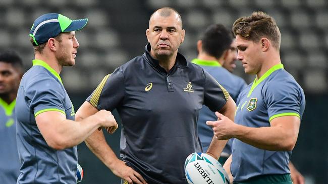 Michael Cheika, centre, with David Pocock, left and Michael Hooper during last year’s World Cup Picture: Rugby AU Media/Stuart Walmsley