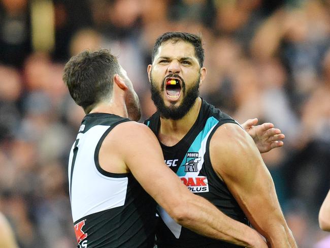 Patrick Ryder of the Power (right) celebrates with teammate Travis Boak after kicking a goal during the Round 8 AFL match between the Port Adelaide Power and the Adelaide Crows at Adelaide Oval in Adelaide, Saturday, May 12, 2018. (AAP Image/David Mariuz) NO ARCHIVING, EDITORIAL USE ONLY