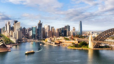 Waterfront architectural landmarks of Sydney city CDB around Circular quay and the Rocks on shores of Harbour in aerial cityscape.