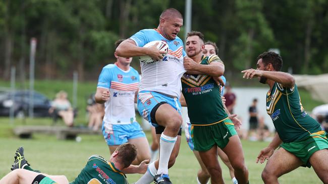 Pride's Brad Lupi puts in a big run in the pre season trial match between the Northern Pride and the Cairns Foley Shield side, held at Petersen Park, Edmonton. PICTURE: BRENDAN RADKE