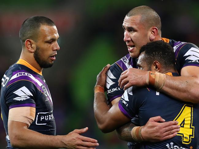 MELBOURNE, AUSTRALIA - SEPTEMBER 21: Nelson Asofa-Solomona of the Storm celebrates his try with Justin Olam of the Storm and Will Chambers of the Storm during the NRL Semi Final match between the Melbourne Storm and the Parramatta Eels at AAMI Park on September 21, 2019 in Melbourne, Australia. (Photo by Kelly Defina/Getty Images)